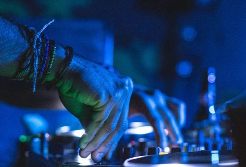 DJ creating mashup with stem splitter